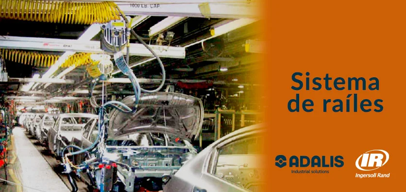 Sistema de raíles con equilibrador en línea de producción automotriz.
