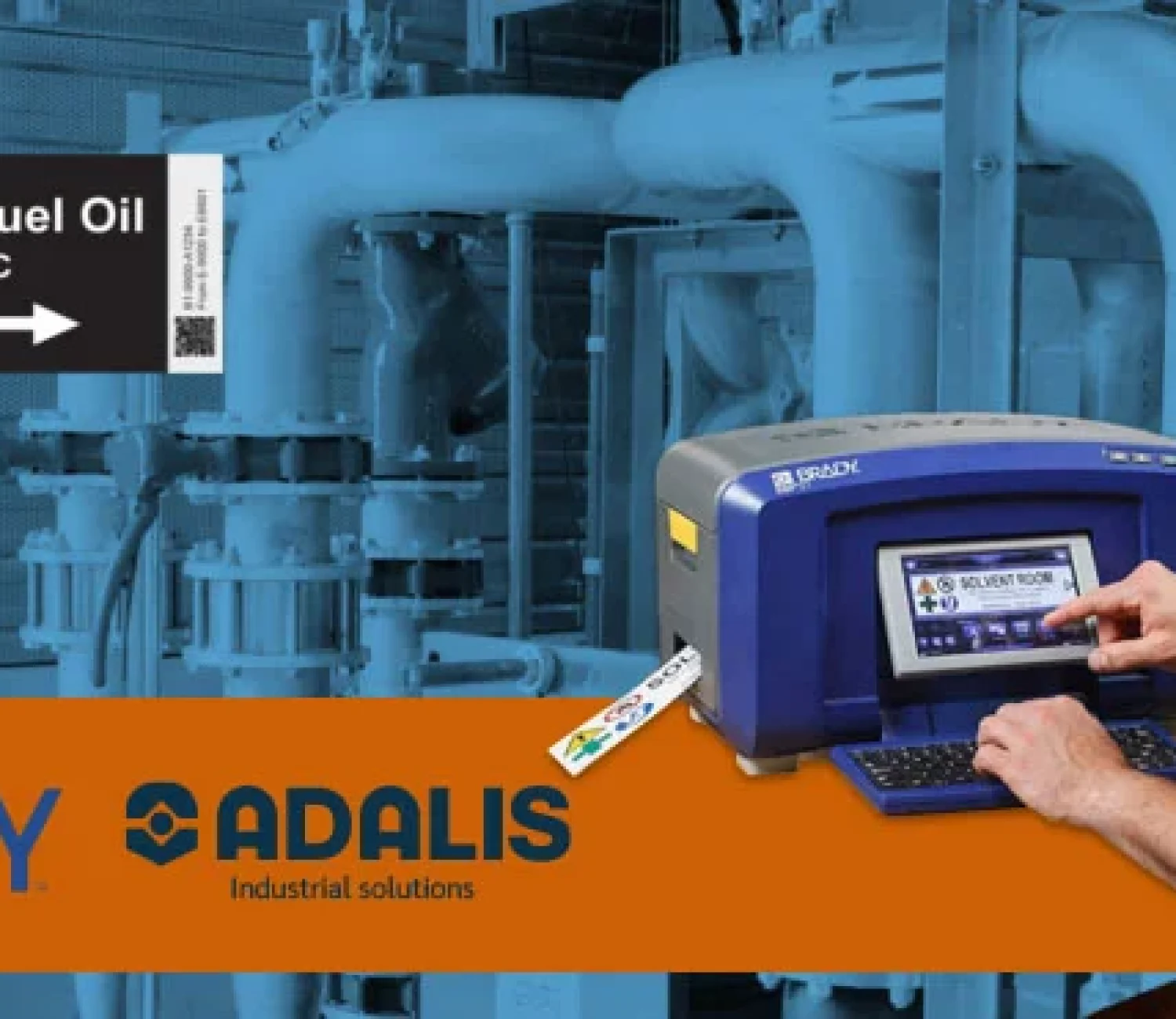 Man using Brady industrial label printer to create chemical safety labels in a mechanical facility