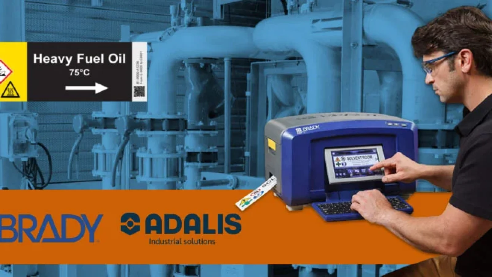 Man using Brady industrial label printer to create chemical safety labels in a mechanical facility