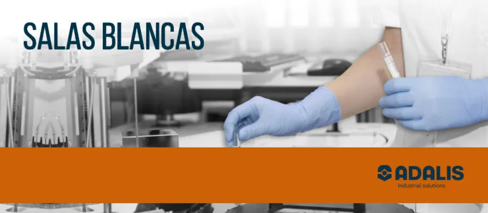 Gloved hands handling test tube in cleanroom lab environment